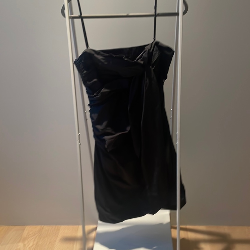 Black strap or strapless dress. Size 8.